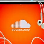 ipad with earphones with soundcloud app