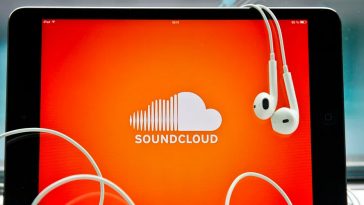 ipad with earphones with soundcloud app