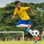 Kid playing football